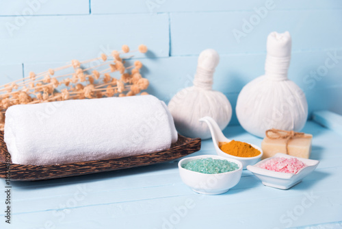 Composition of spa treatment on blue wooden background