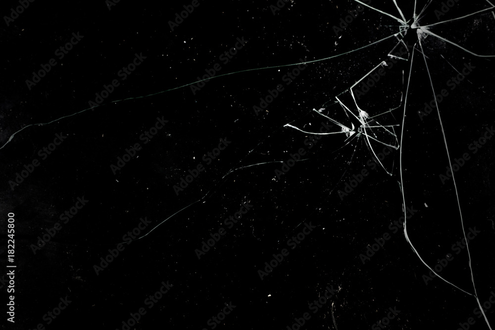 A broken glass on a deep black background. Useful texture for overlay.  Stock-bilde | Adobe Stock