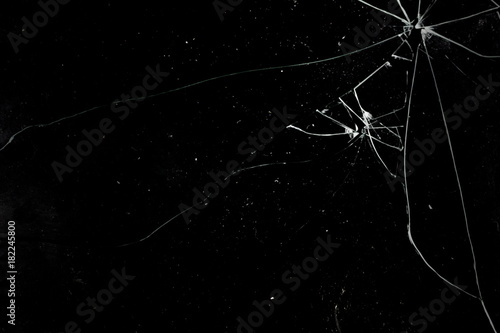 A broken glass on a deep black background. Useful texture for overlay.
