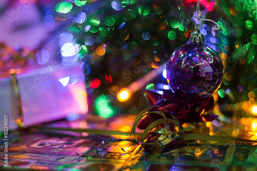 hristmas tree on abstract light bokeh background.