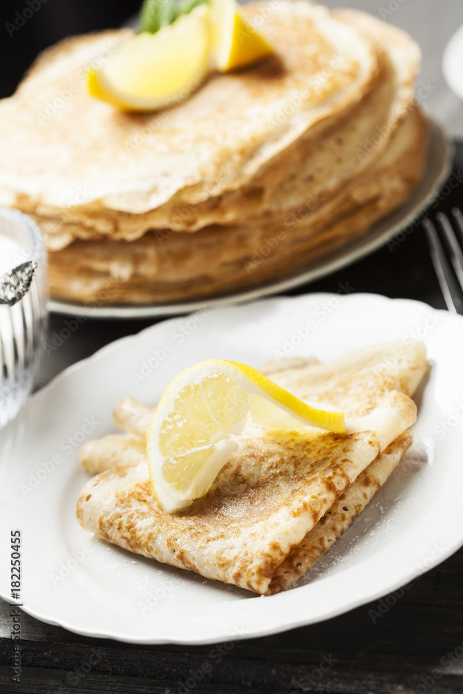 English-style pancakes with lemon and sugar, traditional for Shrove Tuesday. English-style pancakes with lemon and sugar, traditional for Shrove Tuesday.