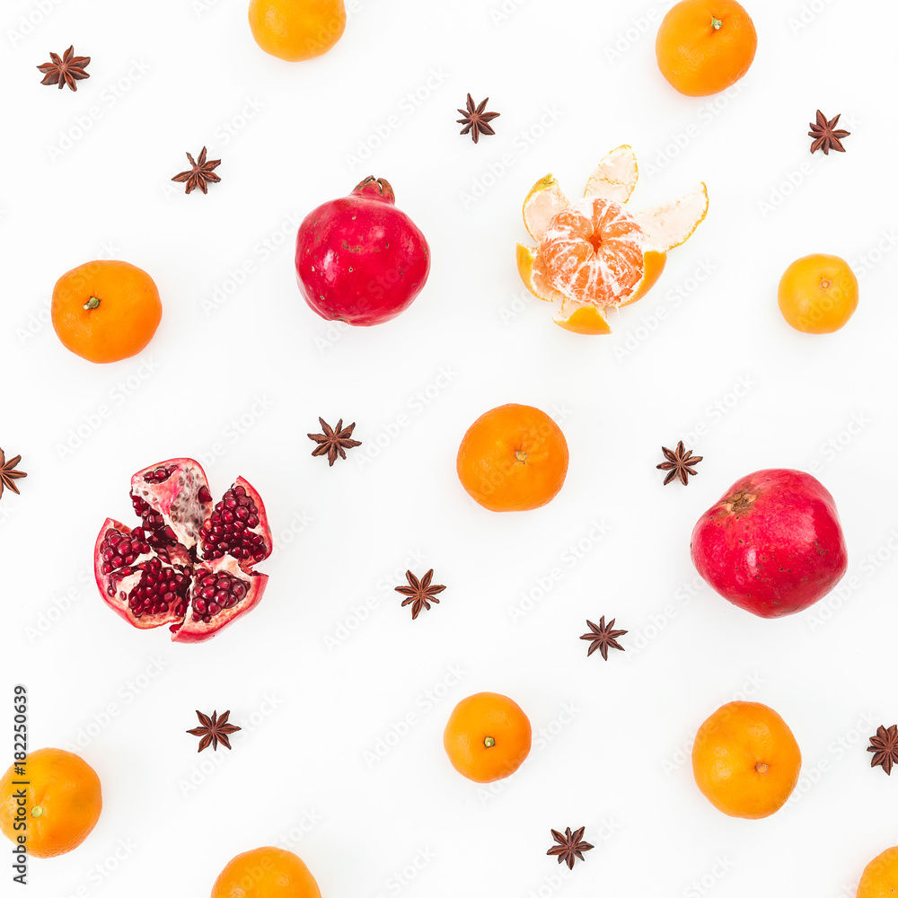 Citrus, garnet and anise on white background. New year holiday concept. Flat lay. Top view Citrus, garnet and anise on white background. New year holiday concept. Flat lay. Top view