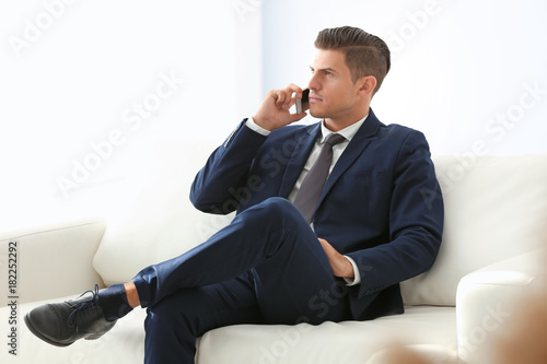 Handsome businessman talkin...