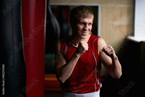 Boxing. Portrait of a boxer on the background of the gym