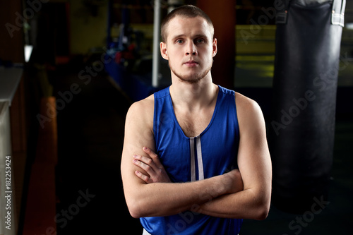 Boxing. Portrait of a boxer on the background of the gym