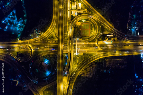 Aerial view light intersection on motorway highway at night