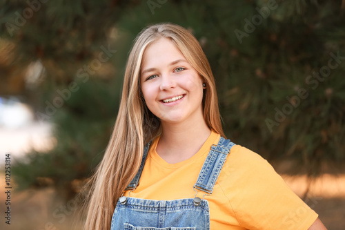 Portrait of cute teenager g...