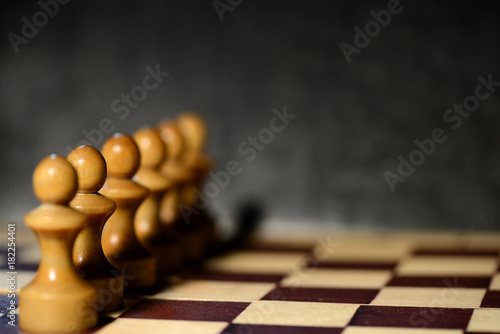 Chess figures on a chessboard close up