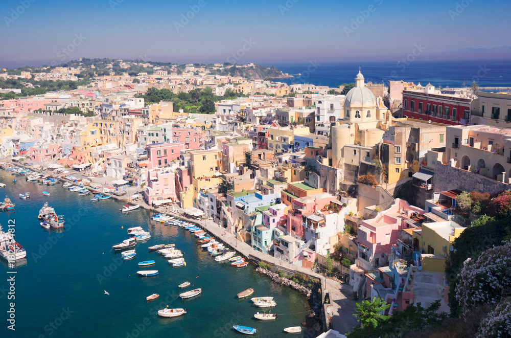 Procida island colorful town with harbour aerial view, Italy