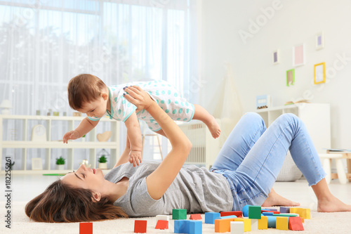 Mother with baby boy playin...