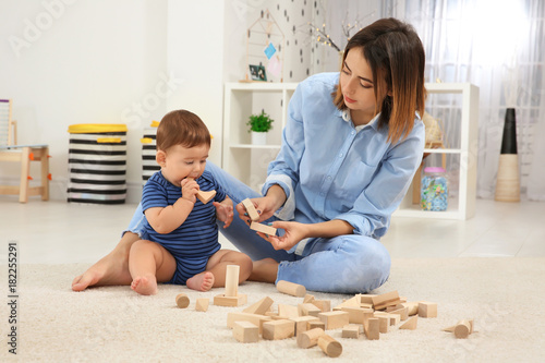 Mother with baby boy playin...