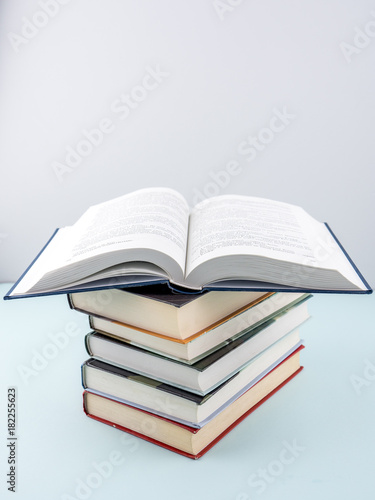 Education concept - books on the gray background 