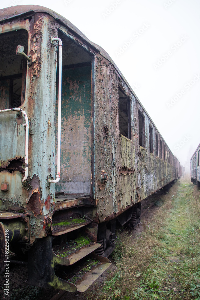 Old rusty trains. Old abandoned track, siding with dirty old trains. Old rusty trains. Old abandoned track, siding with dirty old trains.