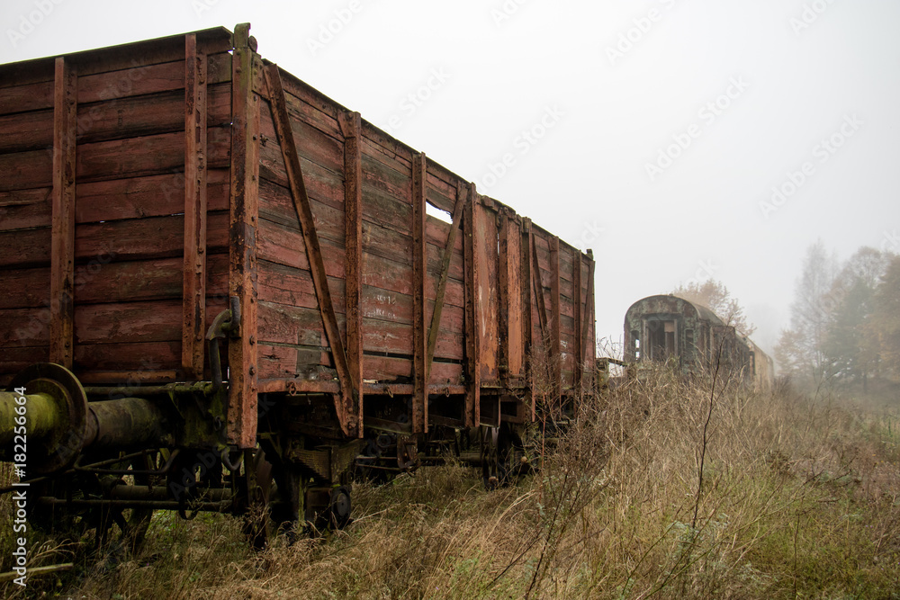 Old rusty trains. Old abandoned track, siding with dirty old trains. Old rusty trains. Old abandoned track, siding with dirty old trains.