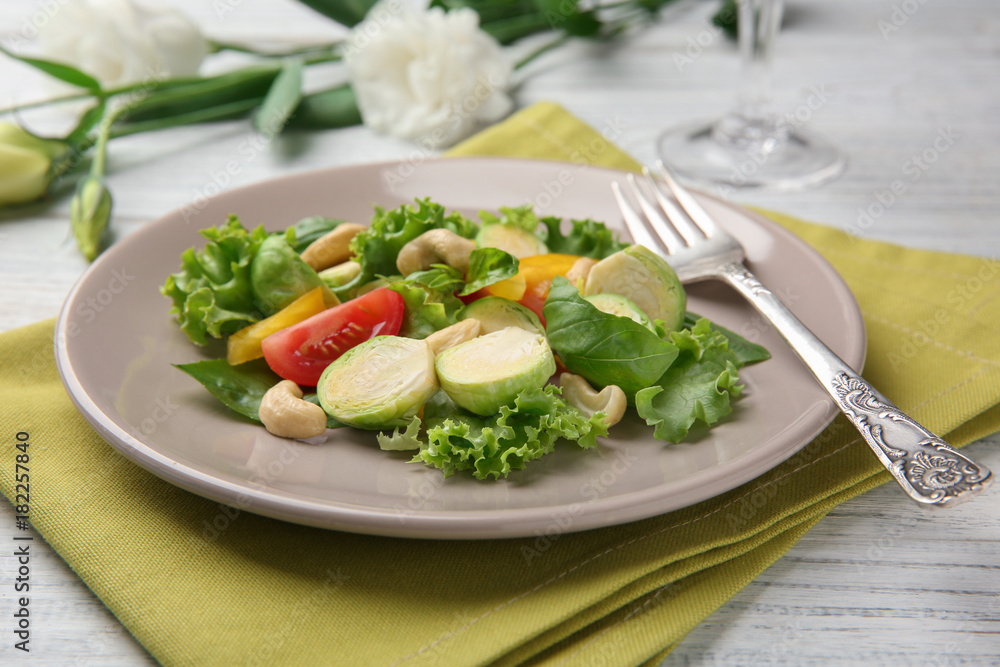 Plate of tasty salad with Brussels sprouts on table Plate of tasty salad with Brussels sprouts on table