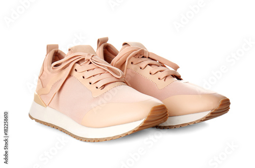 Pair of female sport shoes on white background