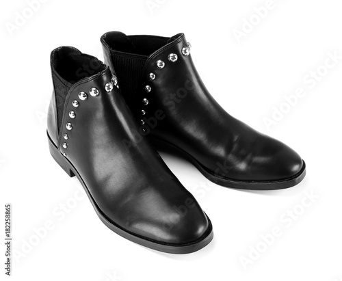 Pair of black female boots on white background