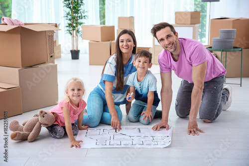 Happy family with house pla...