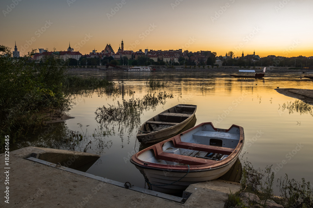 Dusk over the old town and Vistula river in Warsaw, Poland