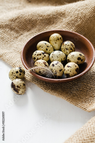 Fresh Organic Quail Eggs in a Ceramic Bowl.