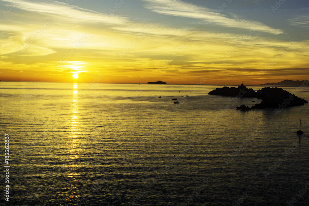 Sun setting over the Adriatic Sea in Dubrovnik, Croatia.