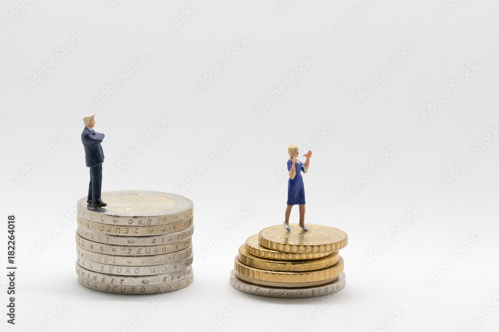 Business man and woman on coins - gender pay gap Business man and woman on coins - gender pay gap