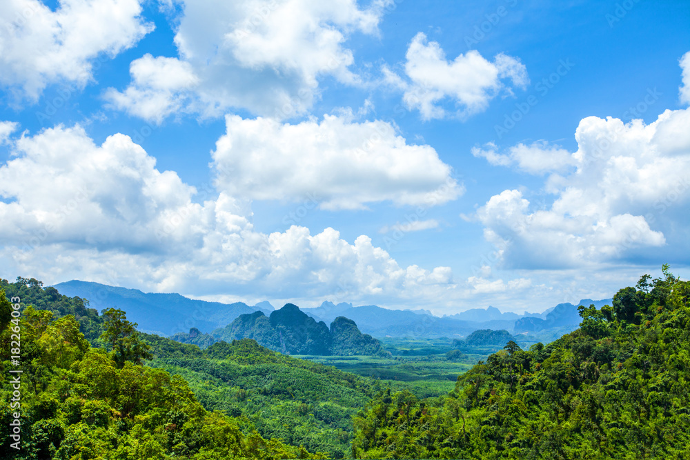 landscape of green mountains and blue sky