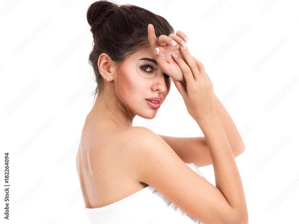 Portrait of beautiful and healthy woman with arrows on her face. Beauty, medicine, plastic surgery and skin care concept. Portrait of beautiful and healthy woman with arrows on her face. Beauty, medicine, plastic surgery and skin care concept.