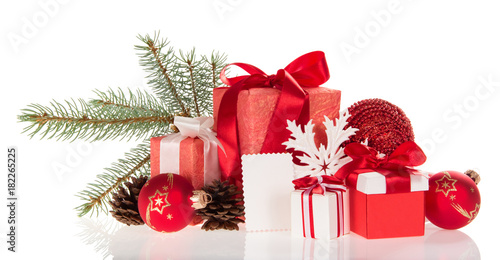 Large and small boxes with gifts, pine branch, cones, toys, and empty card isolated on white