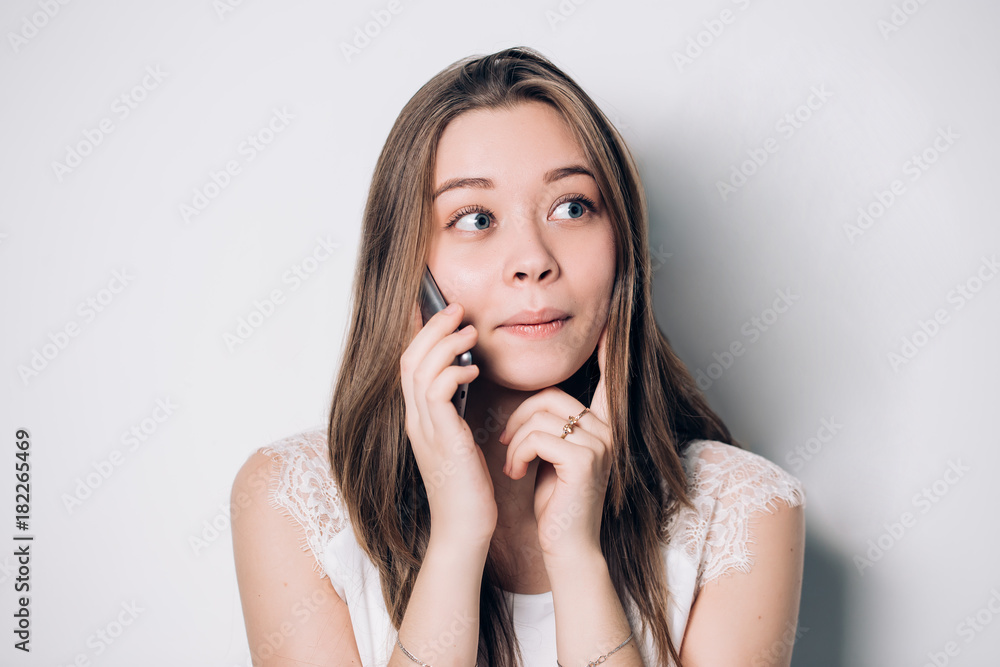 Young Beautiful Woman Talking On Mobile Phone. Emotional happy girl Young Beautiful Woman Talking On Mobile Phone. Emotional happy girl