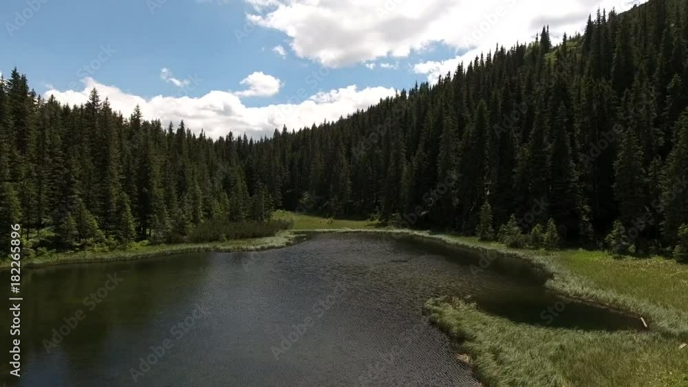 Beautiful mountain lake Maricheika in the Ukrainian Carpathians. Summer sunny day. Ukrainian nature of the beautiful places of the country. Buffer zone. Beautiful mountain lake Maricheika in the Ukrainian Carpathians. Summer sunny day. Ukrainian nature of the beautiful places of the country. Buffer zone.