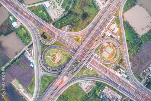 Overpas traffic intersection road topview with green tree in the morning