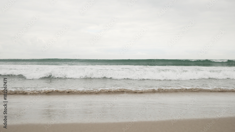 small waves on Santa Monica beach in cloudy november day