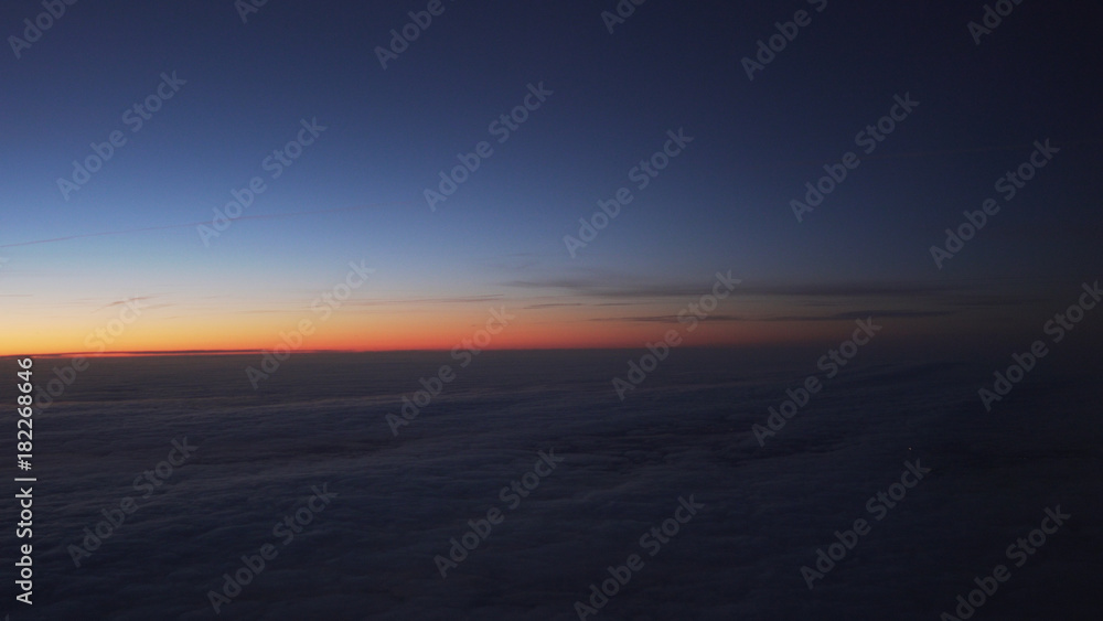 clouds in early morning during flight on a plane clouds in early morning during flight on a plane