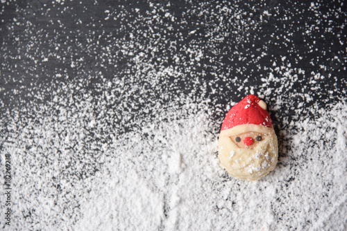 Top view of Christmas cookies on snow.