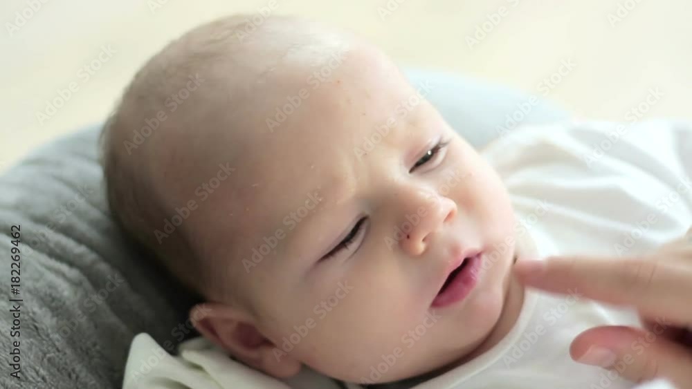 Mother touching baby's nose, close up Mother touching baby's nose, close up