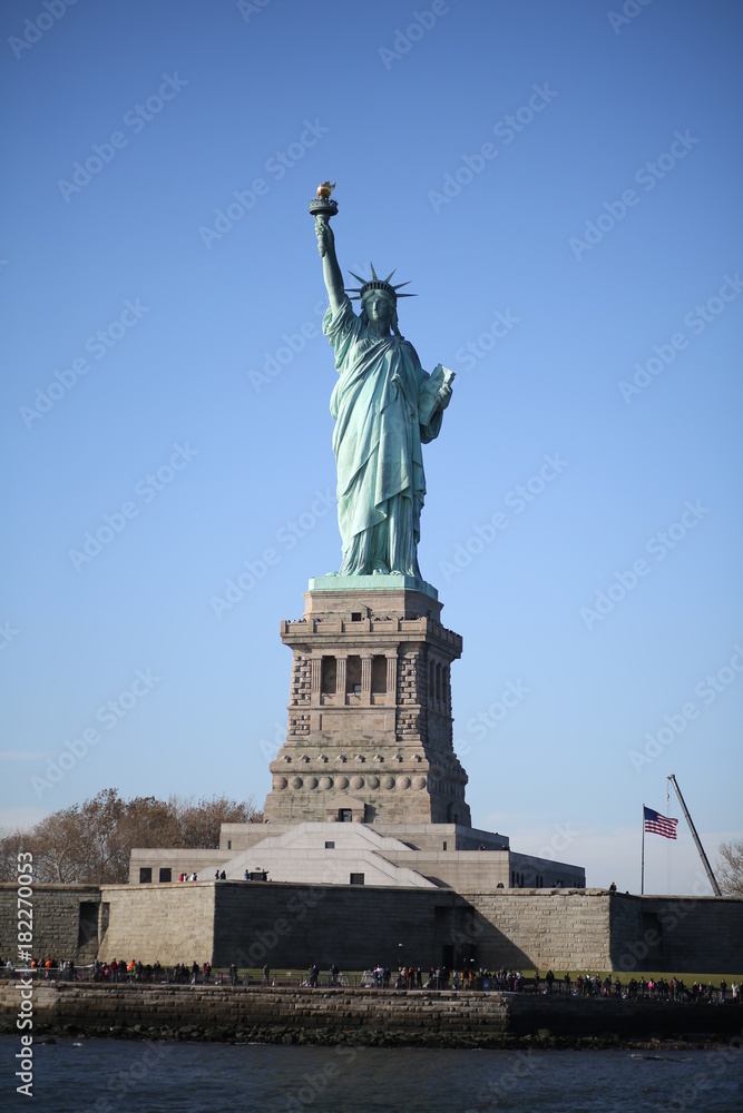 Fototapeta premium The Statue of Liberty on Ellis Island in New York City Photographed from the Hudson River