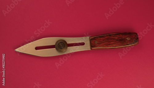 simple and functional form of a launch knife with wooden handle photo