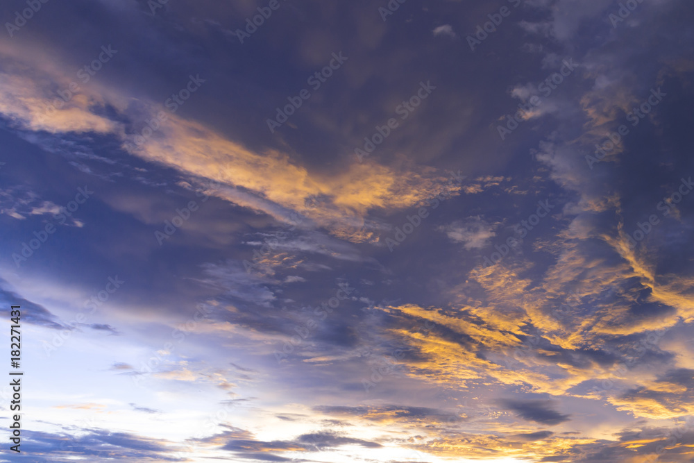 sunset / sun rise sky with yellow and red light shining clouds and sky background and texture