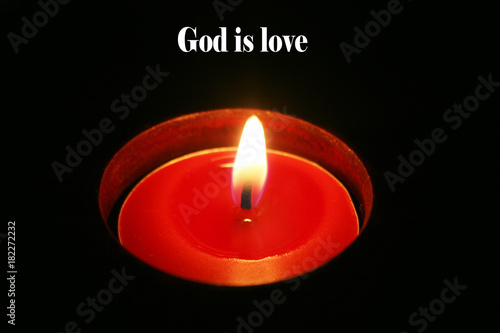 Red Tea Candle Close Up With "God Is Love" High Quality 