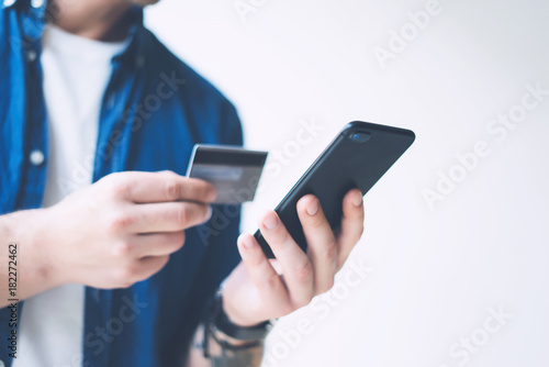 Man with smartphone and credit card