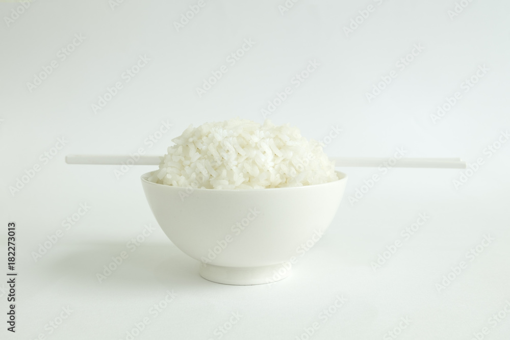 RICE BOWL WITH CHOPSTICKS
Steamed rice in a white bowl served with white chopsticks on a white background. RICE BOWL WITH CHOPSTICKS
Steamed rice in a white bowl served with white chopsticks on a white background.