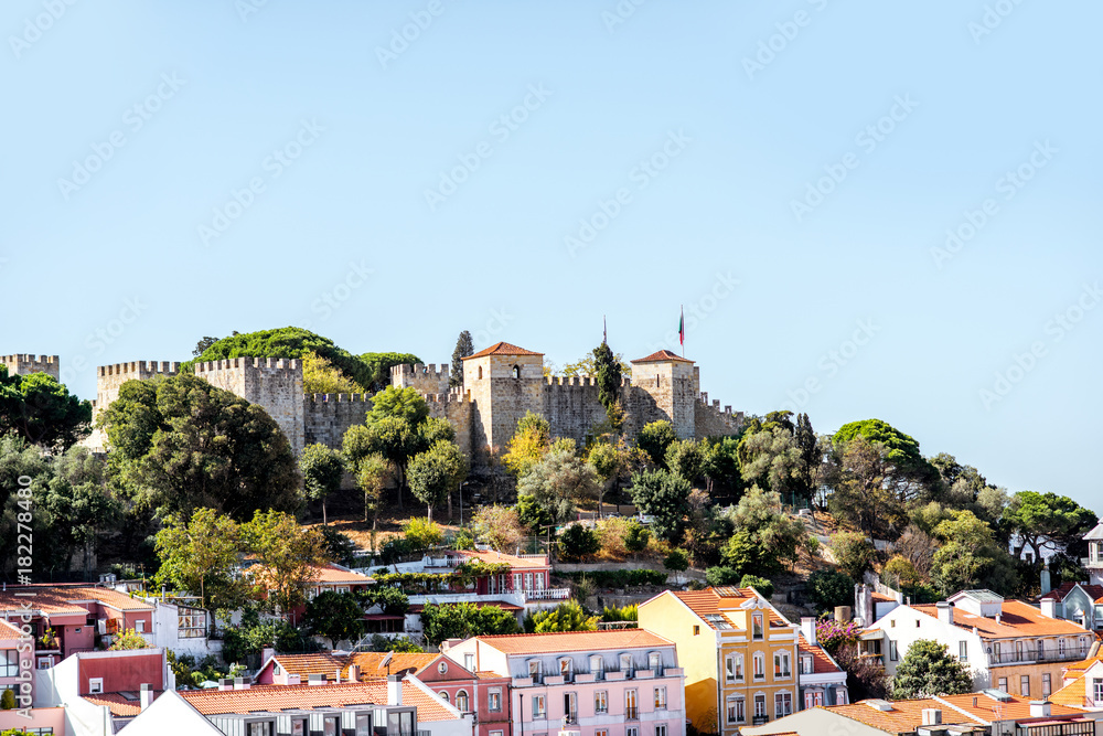 Cityscape view on the old town with castle hill during the sunny day in Lisbon city, Portugal