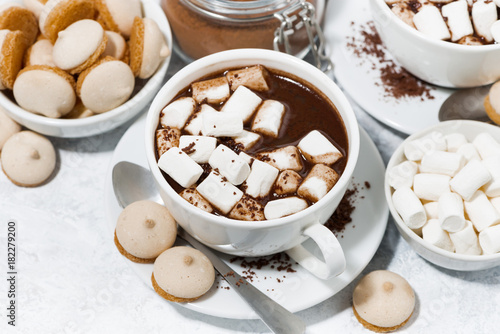 cups of hot chocolate with marshmallows on white background, top view