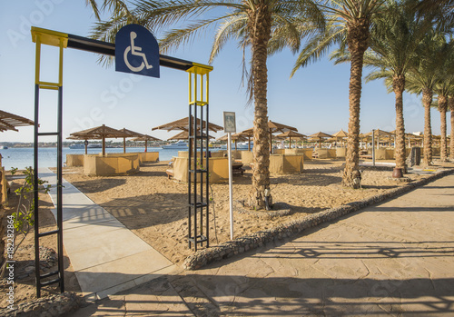 Tropical sandy beach with disabled access at a hotel resort