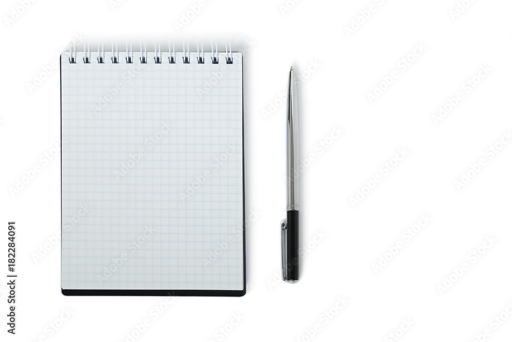 Silver ballpoint pen with open notebook. isolated Silver ballpoint pen with open notebook. isolated