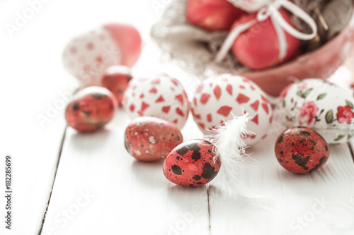 Easter eggs on a light wood background, photo