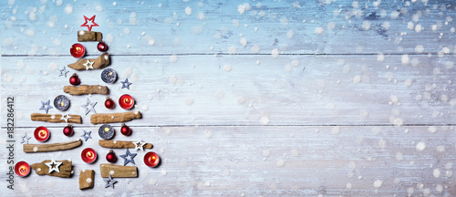 Christmas tree and snowflakes on wooden background  -  Flat lay  Panorama  Banner