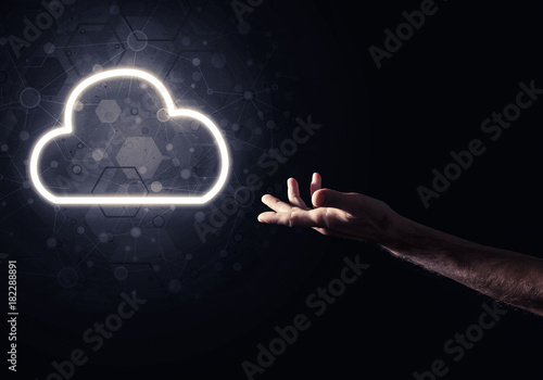 Digital cloud icon as symbol of wireless connection on dark back