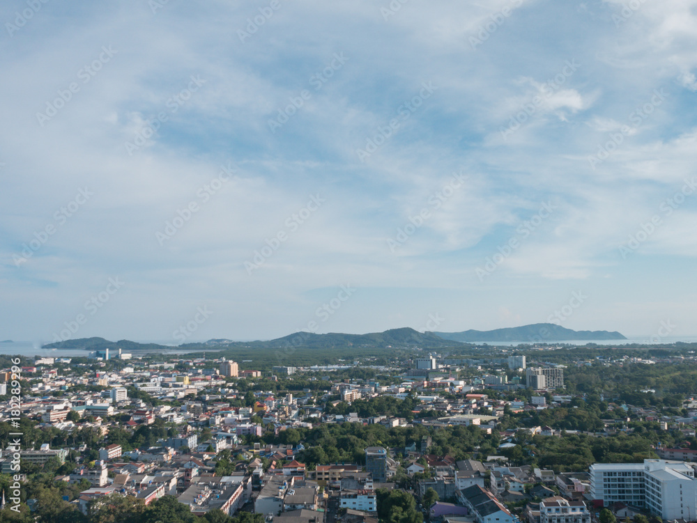cloudy blue sky background and cityscape from the viewpoint on hilltop